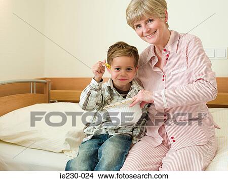 Grandson visiting grandmother in hospital View Large Photo Image Picture - Grandson visiting grandmother in hospital. Fotosearch