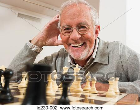 Senior man playing chess View Large Photo Image Stock Image - Senior man playing chess. Fotosearch
