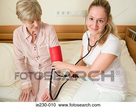 Senior woman having her blood pressure checked View Large Photo Image Stock Image - Senior woman having her blood pressure checked. Fotosearch