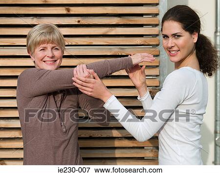 Senior woman receiving physiotherapy View Large Photo Image Stock Photo - Senior woman receiving physiotherapy. Fotosearch