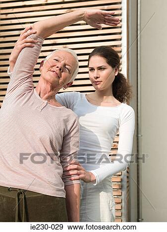 Senior woman receiving physiotherapy View Large Photo Image Stock Photo - Senior woman receiving physiotherapy. Fotosearch