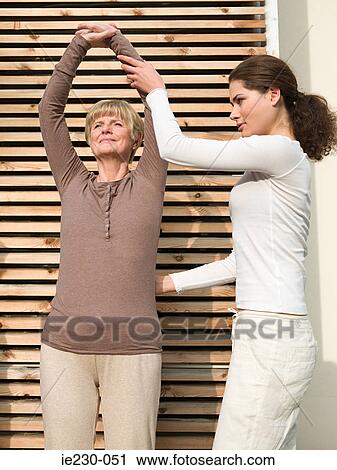 Senior woman stretching View Large Photo Image Stock Image - Senior woman stretching. Fotosearch