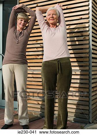 Senior women stretching View Large Photo Image Stock Image - Senior women stretching. Fotosearch