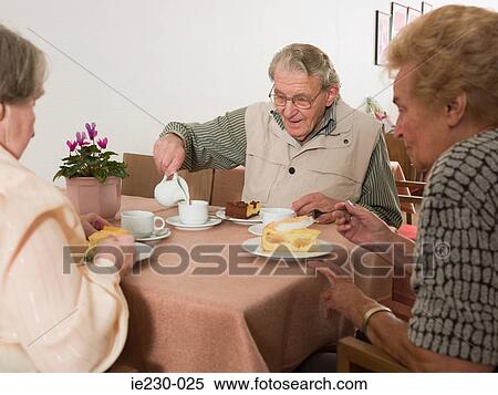 Seniors eating cake View Large Photo Image Stock Photography - Seniors eating cake. Fotosearch