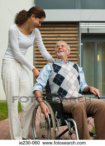 Woman with a disabled senior man View Large Photo Image Stock Image - Woman with a disabled senior man. Fotosearch