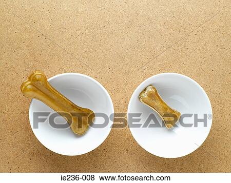 Dog bones in a bowl View Large Photo Image Stock Photo - Dog bones in a bowl. Fotosearch