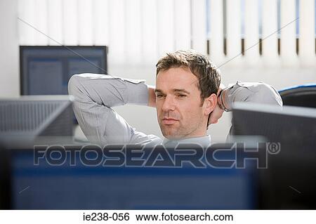 Stock Photograph - A businessman thinking. Fotosearch