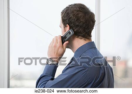 Businessman using a cell phone View Large Photo Image Picture - Businessman using a cell phone. Fotosearch