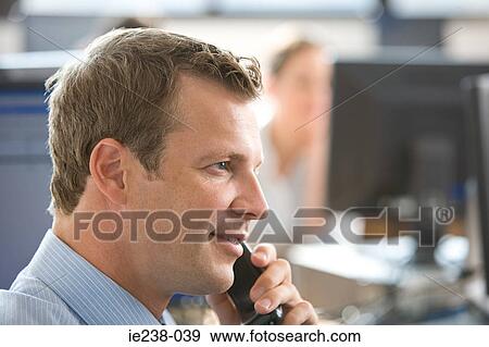 Businessman using a telephone View Large Photo Image Stock Photo - Businessman using a telephone. Fotosearch