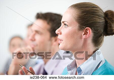 Businesspeople talking in a meeting View Large Photo Image Picture - Businesspeople talking in a meeting. Fotosearch