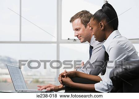 Businesspeople working together View Large Photo Image Stock Photo - Businesspeople working together. Fotosearch
