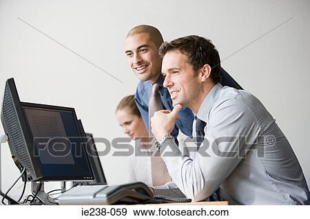 Businesspeople working together View Large Photo Image Stock Photo - Businesspeople working together. Fotosearch