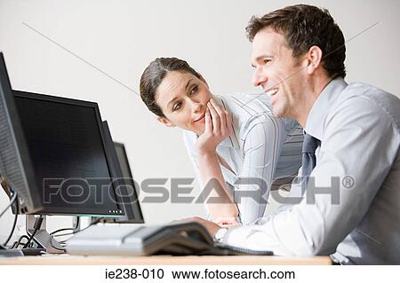 Colleagues talking View Large Photo Image Stock Image - Colleagues talking. Fotosearch