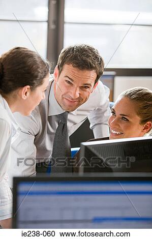 Stock Image - Colleagues talking. Fotosearch