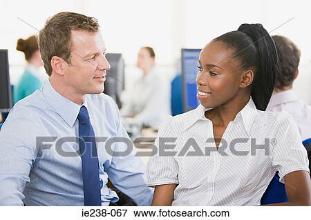 Colleagues talking View Large Photo Image Stock Photo - Colleagues talking. Fotosearch