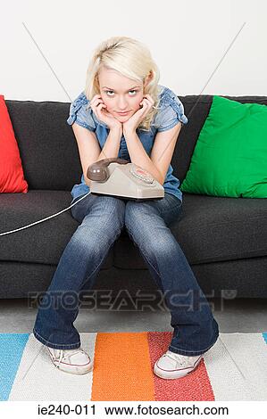 Bored woman waiting for a phone call View Large Photo Image Stock Image - Bored woman waiting for a phone call. Fotosearch