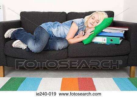 Female student sleeping on sofa View Large Photo Image Stock Photo - Female student sleeping on sofa. Fotosearch
