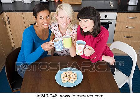 Three women drinking tea View Large Photo Image Stock Photograph - Three women drinking tea. Fotosearch