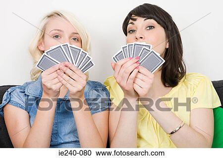 Two women playing cards View Large Photo Image Stock Image - Two women playing cards. Fotosearch