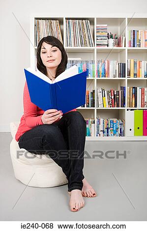 Woman reading a book View Large Photo Image Stock Photo - Woman reading a book. Fotosearch