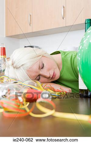Stock Image - Woman sleeping after a party. Fotosearch