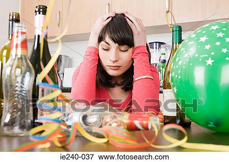 Stock Photo - Woman with a hangover after a party. Fotosearch