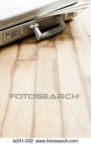 A briefcase on a wooden floor View Large Photo Image Stock Image - A briefcase on a wooden floor. Fotosearch