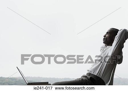 Stock Photo - A businessman thinking. Fotosearch