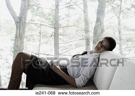 A businesswoman relaxing View Large Photo Image Stock Photo - A businesswoman relaxing. Fotosearch