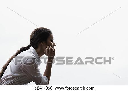 Stock Photograph - A businesswoman thinking. Fotosearch
