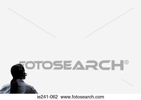 A businesswoman wearing a headset View Large Photo Image Stock Image - A businesswoman wearing a headset. Fotosearch