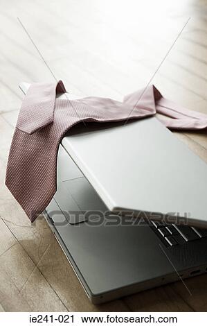 Stock Image - A tie on a laptop. Fotosearch