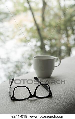 Stock Photo - Glasses cup and sofa. Fotosearch