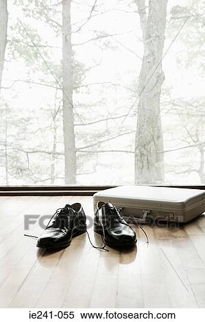 Shoes and a briefcase on a wooden floor View Large Photo Image Stock Photography - Shoes and a briefcase on a wooden floor. Fotosearch