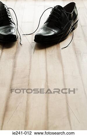 Shoes on a wooden floor View Large Photo Image Stock Image - Shoes on a wooden floor. Fotosearch