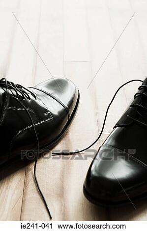 Shoes on a wooden floor View Large Photo Image Stock Image - Shoes on a wooden floor. Fotosearch