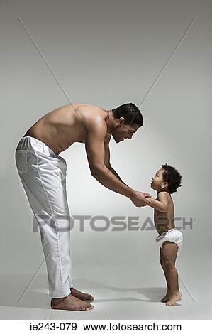 Stock Photo - Father and son holding hands. Fotosearch
