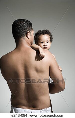 Father holding his son View Large Photo Image Picture - Father holding his son. Fotosearch