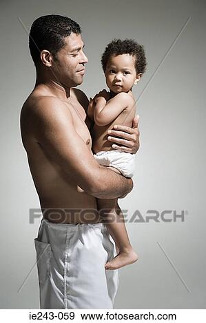 Father holding his son View Large Photo Image Stock Photo - Father holding his son. Fotosearch