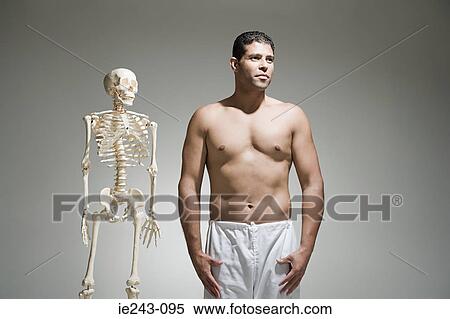 Man and a skeleton View Large Photo Image Stock Photography - Man and a skeleton. Fotosearch