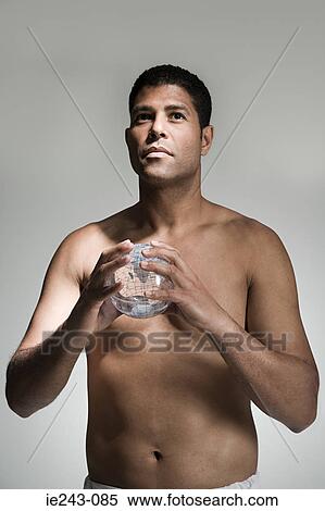 Man holding a globe View Large Photo Image Stock Photography - Man holding a globe. Fotosearch