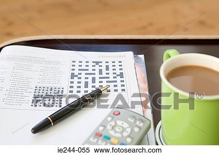 A crossword pen and cup of tea View Large Photo Image Stock Photography - A crossword pen and cup of tea. Fotosearch