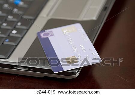 A laptop and a credit card View Large Photo Image Stock Photo - A laptop and a credit card. Fotosearch