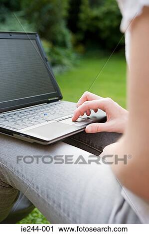 Stock Image - A woman using a laptop. Fotosearch