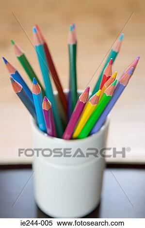 Stock Photography - Coloured pencils in a desk tidy. Fotosearch