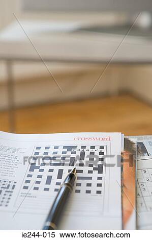 Stock Photography - Crossword and pen. Fotosearch