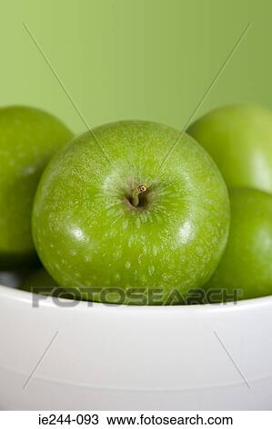 Stock Image - Green apples in a bowl. Fotosearch