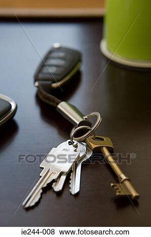 Keys on a table View Large Photo Image Stock Photo - Keys on a table. Fotosearch