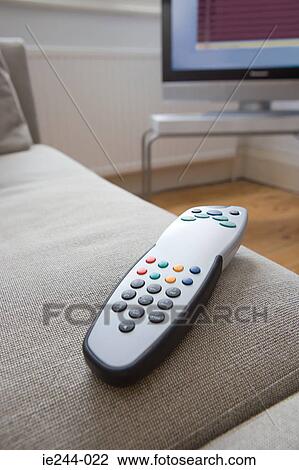 Remote control on a sofa View Large Photo Image Stock Image - Remote control on a sofa. Fotosearch