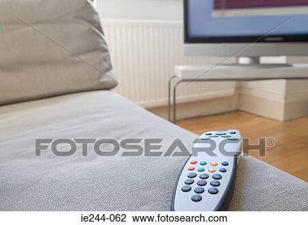 Remote control on a sofa View Large Photo Image Stock Image - Remote control on a sofa. Fotosearch